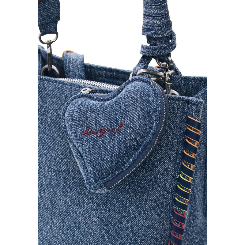 Desigual blue zippered bag with pockets featuring a denim heart-shaped charm with red embroidered logo on a blue tote