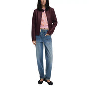 Woman wearing Desigual Bordeaux Zip Front Long Blazer with pink patterned crop top and jeans