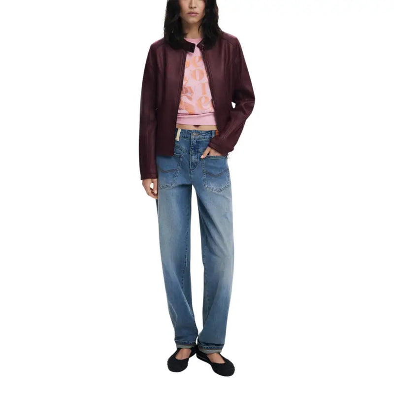 Woman wearing Desigual Bordeaux Zip Front Long Blazer with pink patterned crop top and jeans