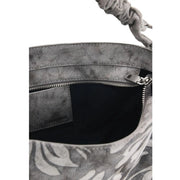 Desigual grey floral cotton handbag with gray distressed leather bucket bag style, braided handle, and tropical leaf print