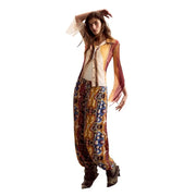 A woman wears a desigual women beige long sleeve round neck classic shirt with vibrant sheer sleeves and paisley pants
