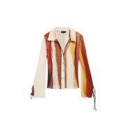Desigual women beige long sleeve blouse with vibrant orange red abstract flame pattern and sheer fabric panels
