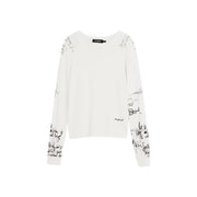 White long sleeve knitwear with black handwritten print featuring desigual label at the neckline for women