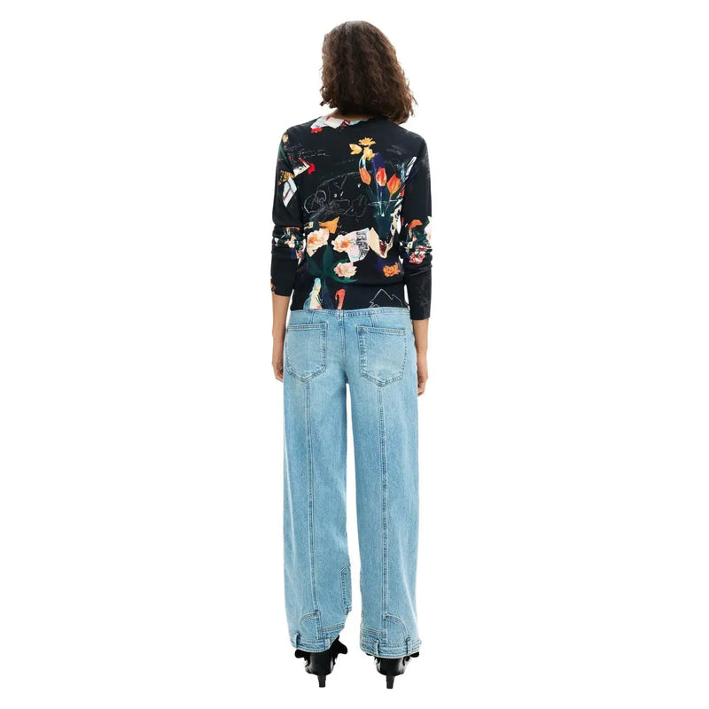 Desigual women black print long sleeve round neck knitwear featuring vibrant floral and abstract design paired with wide-leg jeans