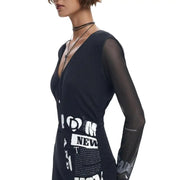 Black Desigual women’s dress with V-neck, sheer long sleeves, and white graphic print