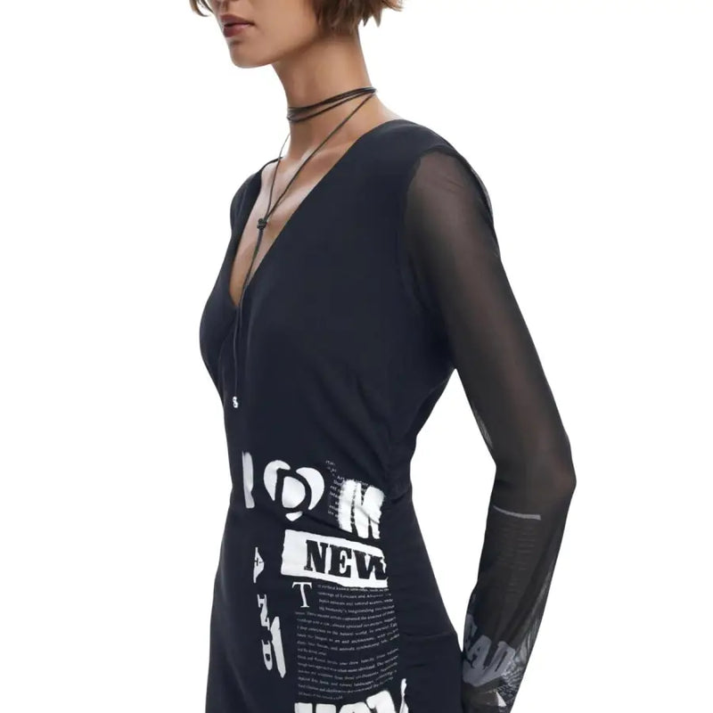 Black Desigual women’s dress with V-neck, sheer long sleeves, and white graphic print