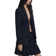 Black floral-embroidered blazer and matching pleated mini skirt from Desigual Women Fall Winter collection