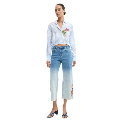 Light blue denim jeans with gradient fade to white and colorful floral embroidery on side seams by desigual