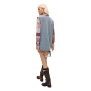 A woman wearing a desigual women grey polyester sleeveless low cut dress with floral pattern and gray knit vest