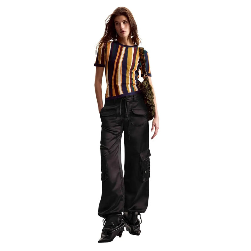 Black satin cargo pants with multiple pockets and drawstring waistband paired with Desigual women mustard striped viscose t shirt