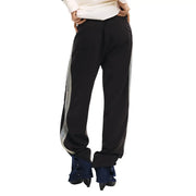 Desigual Damenhose, schwarze, schmal geschnittene Trainingshose aus Baumwollmischgewebe mit silbernen Reflexstreifen und umgeschlagenen Säumen