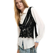 Black lace vest with intricate floral patterns and scalloped edges complementing Desigual women white cotton classic button shirt