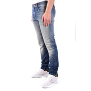 Diesel men blue cotton jeans with worn effect featuring faded distressed wash and subtle whiskering details