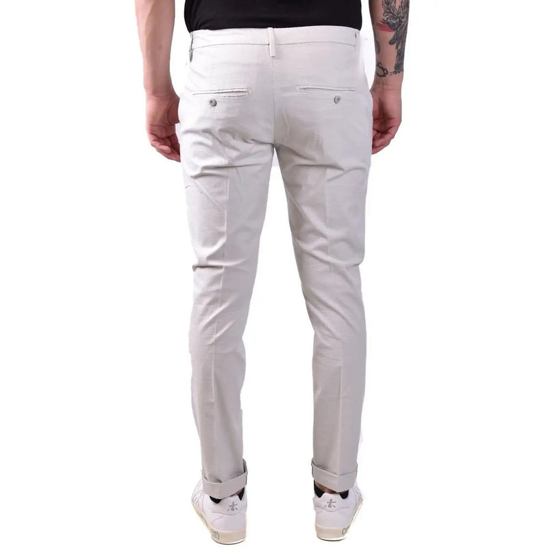 Dondup men grey cotton trousers showing cream-colored slim-fit chinos with subtle texture and buttoned back pockets visible from the back