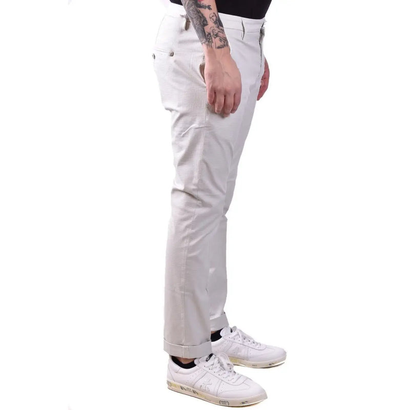 Dondup men grey cotton trousers with slim fit light beige chino pants and subtle waistband pleats visible from the front