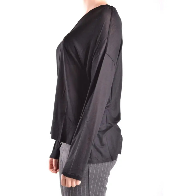 Black long-sleeved V-neck top paired with striped trousers from Dondup Women collection