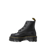 Dr martens black leather ankle boots for women showing the textured leather upper from the back side