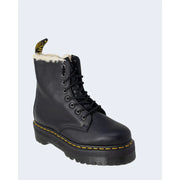 Black leather dr martens ankle boots for women showing the back side with signature heel loop and stitching