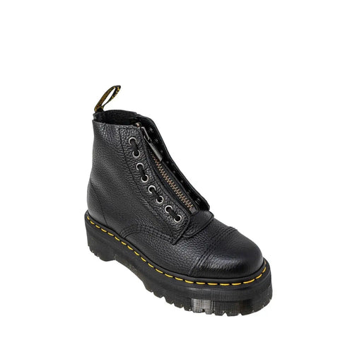 Black leather ankle boots for women by dr martens shown from the back side with a sleek design