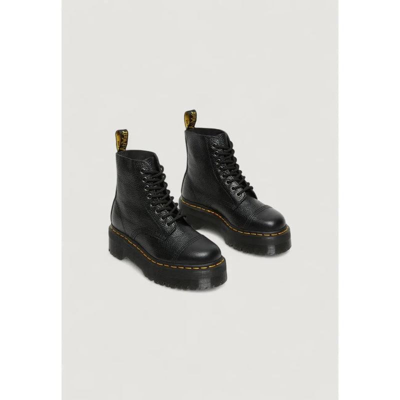 Dr Martens black leather ankle boots for women showing the back side with signature heel loop detail