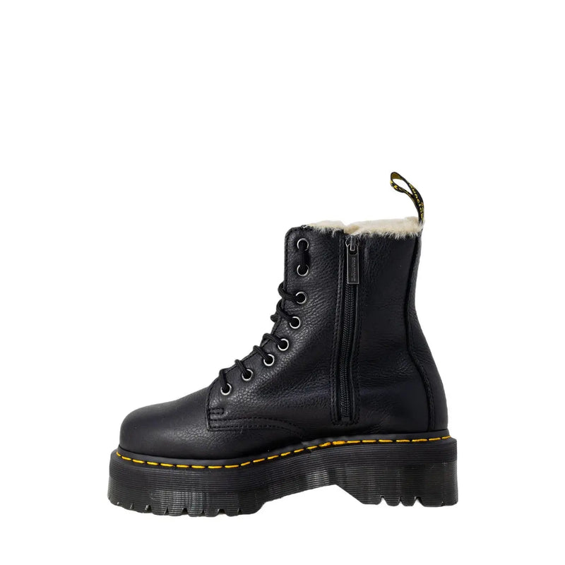 Black leather dr martens ankle boots for women shown from the back side highlighting durable leather material