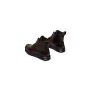 Dunkelbraune Dr. Martens Brookline Chukka-Stiefel für Herren aus Leder, die die Rückseite des Schuhwerks zeigen