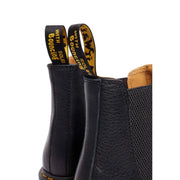 Dr Martens men leather ankle boots black with textured leather upper tan lining and yellow branding on pull tabs