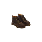 Dunkelbraune Dr. Martens Herren-Chukka-Stiefel aus Leder, Nahaufnahme des strukturierten Ledermaterials