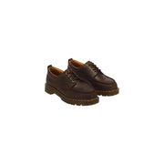 Braune Dr. Martens Herren-Slipper aus Leder, Modell Lowell, zeigt die Rückseite des Schuhs.
