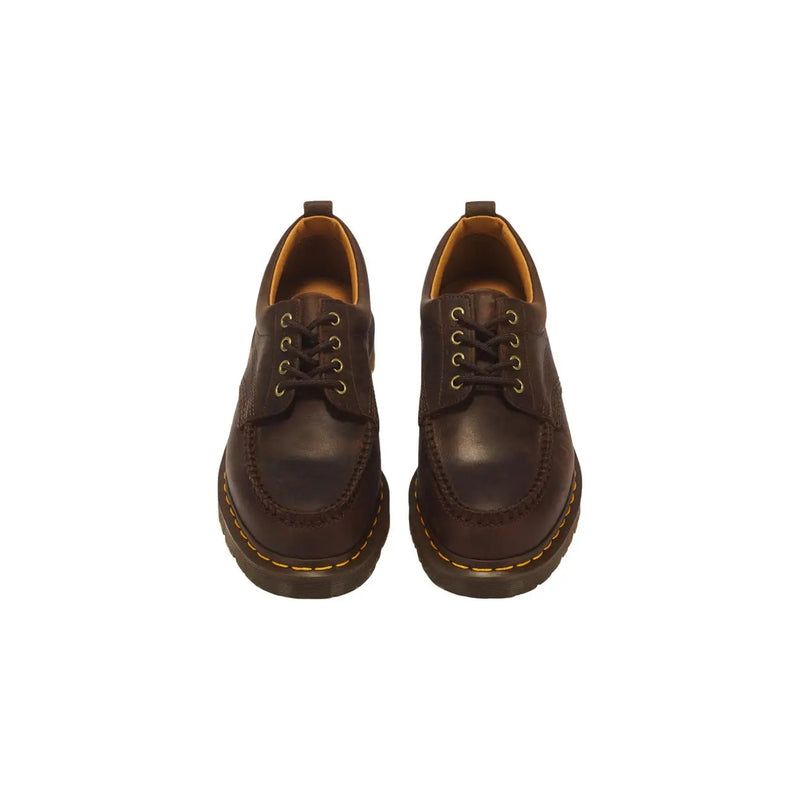 Dunkelbraune Herren-Slipper aus Leder von Dr. Martens mit glatter Oberfläche und flachem Profil
