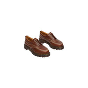Braune Dr. Martens Herren-Schnürschuhe aus butterscotchfarbenem Leder, die Rückseite des Schuhs zeigen