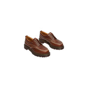 Brown leather dr Martens men Lowell butterscotch leather lace up shoes showing the back side of the shoe