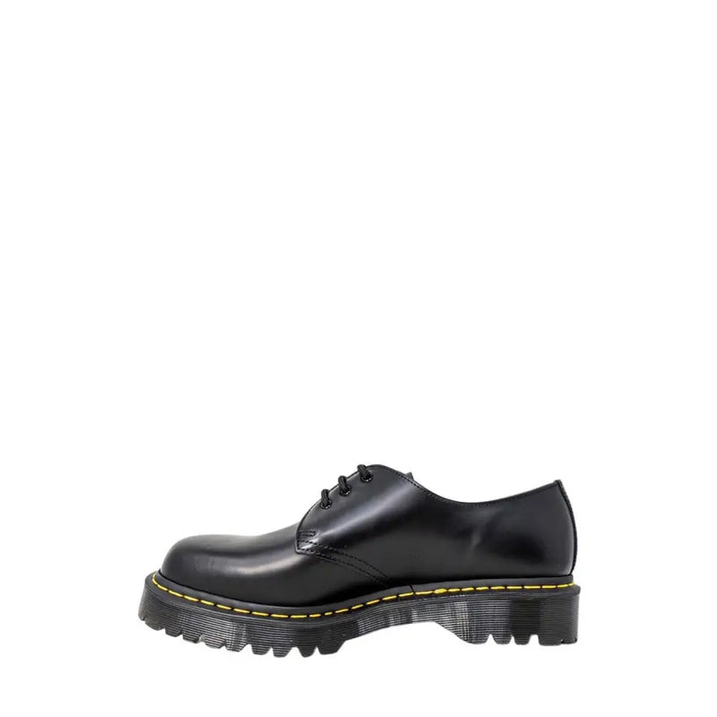 Dr Martens men’s black leather lace-up shoes showing the back side with durable stitching and heel loop
