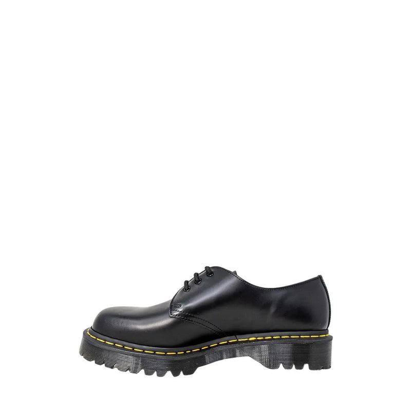 Dr Martens men’s black leather lace-up shoes showing the back side with durable stitching and heel loop