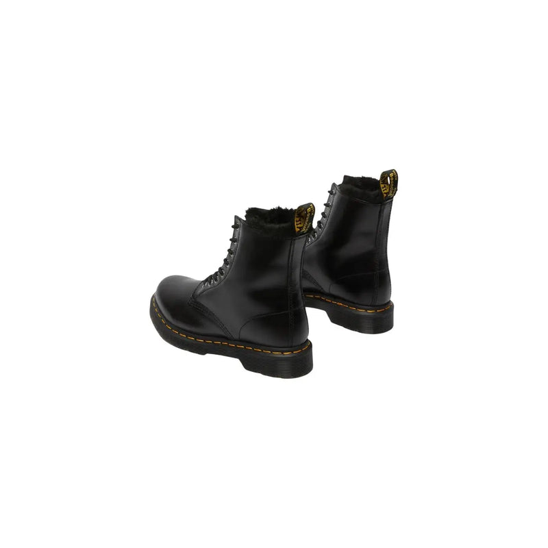 Dr Martens women black patent leather boots showing the back side designed for fall and winter use