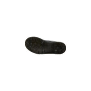 Black rubber sole with deep tread pattern and embossed logo shown on dr martens women black leather boots fall winter