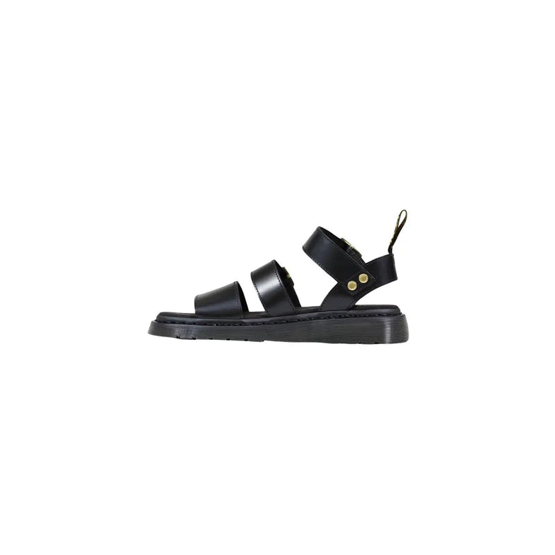 Dr Martens women black leather buckle sandals with chunky sole and gold-tone hardware shown from the back side