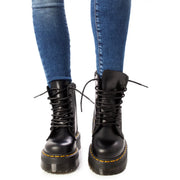 Black leather dr martens women lace boots size 4 shown from the back side displaying heel detail