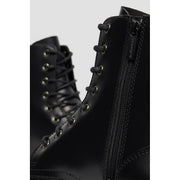 Dr Martens women black leather lace boots size 4 shown from the back side highlighting the sturdy heel design