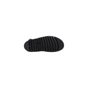 Black rubber sole with textured ribbed pattern and small logo near the heel of dr martens women black leather sandals with buckle