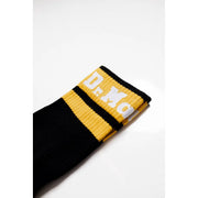 Schwarze und gelbe Sportsocke mit weißer Schrift am top Hergestellt aus einem Baumwollmischgewebe mit Stretchanteil für Damen von Dr. Martens