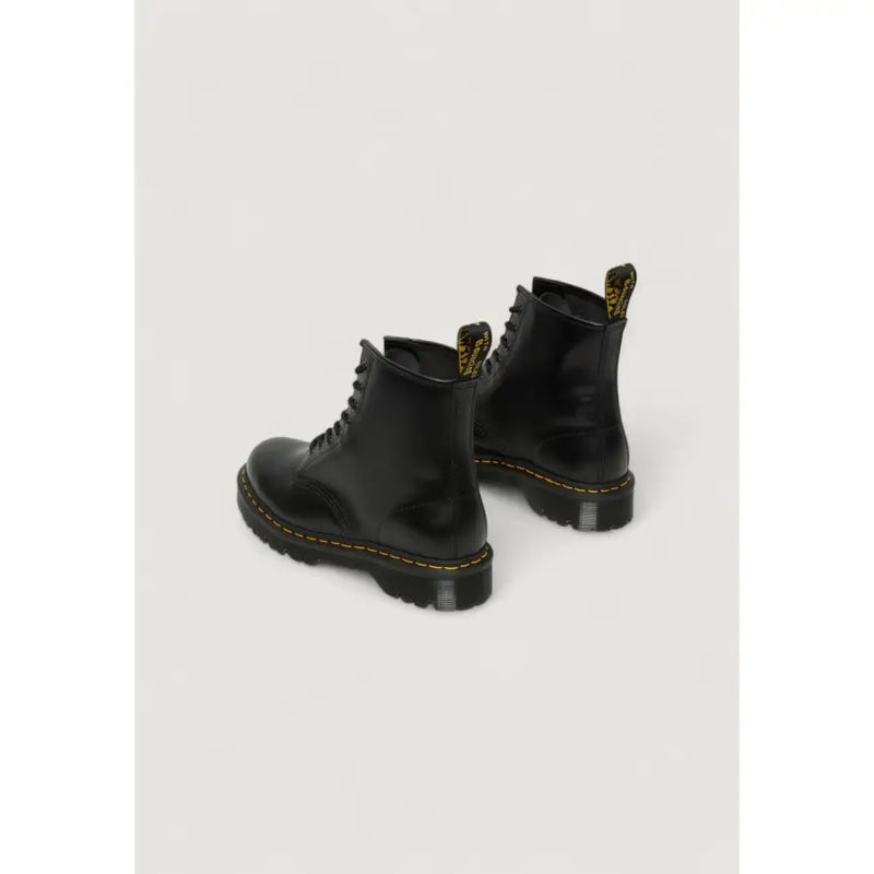Dr Martens women’s black leather ankle boots shown from the back side, ideal for fall and winter wear