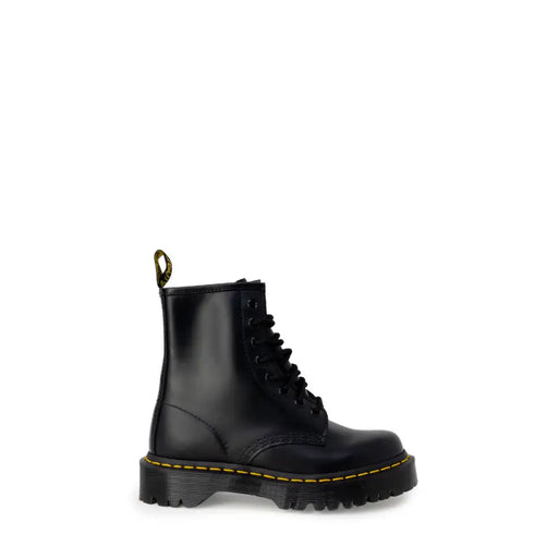 Black leather ankle boots by dr martens for women shown from the back ideal for fall and winter wear