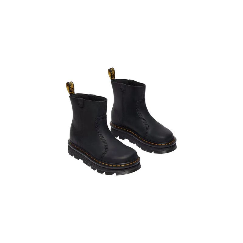 Dr Martens women’s black leather ankle boots showing the back side with signature stitching and heel loop
