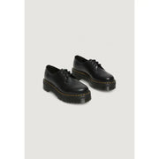 Schwarze Dr. Martens Damen-Schnürschuhe aus Leder, von der Rückseite mit charakteristischer Sohle und Naht gezeigt.
