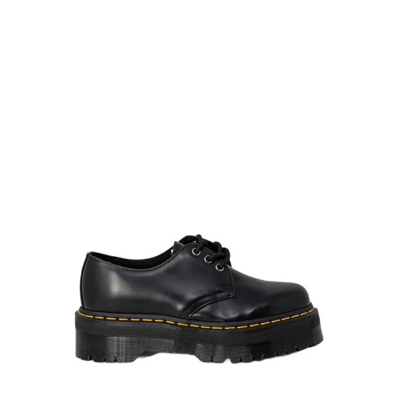 Schwarze Dr. Martens Damen-Plateau-Schnürschuhe aus Leder mit gelben Ziernähten und dicker Sohle
