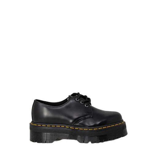 Schwarze Dr. Martens Damen-Plateau-Schnürschuhe aus Leder mit gelben Ziernähten und dicker Sohle