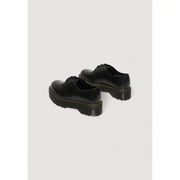Schwarze Dr. Martens Damen-Schnürschuhe aus Leder, hier von hinten gezeigt, wobei die robuste Konstruktion hervorgehoben wird.