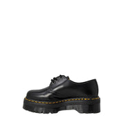 Dr. Martens Damen-Plateau-Schnürschuh aus schwarzem Leder mit gelben Ziernähten und dicker Sohle
