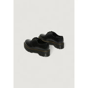 Dr Martens women’s black leather lace up shoes shown from the back side highlighting their durable design